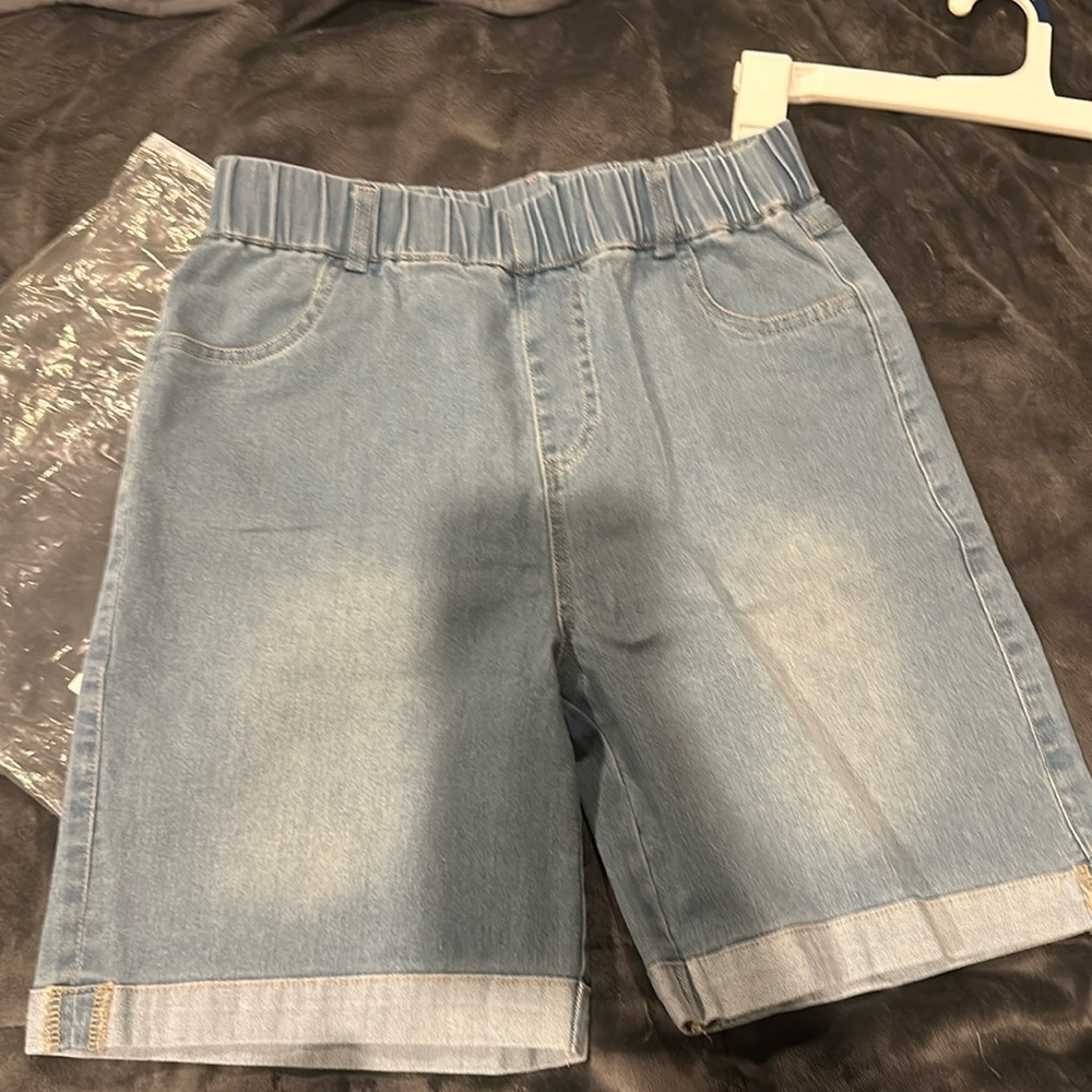 Light blue jean shorts elastic top, no button or zipper new in bag.